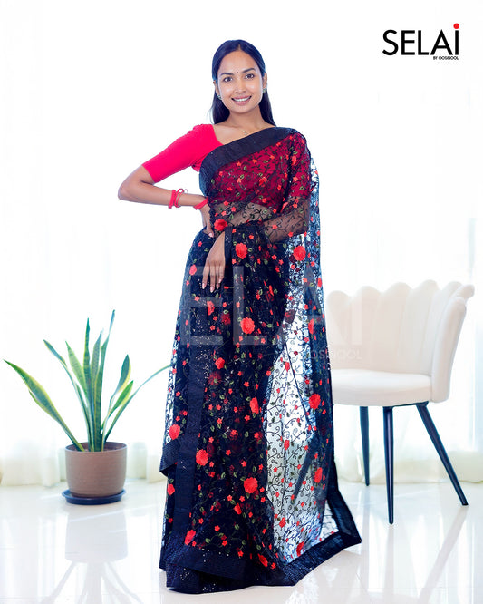 Black sequence and thread embroidered net saree