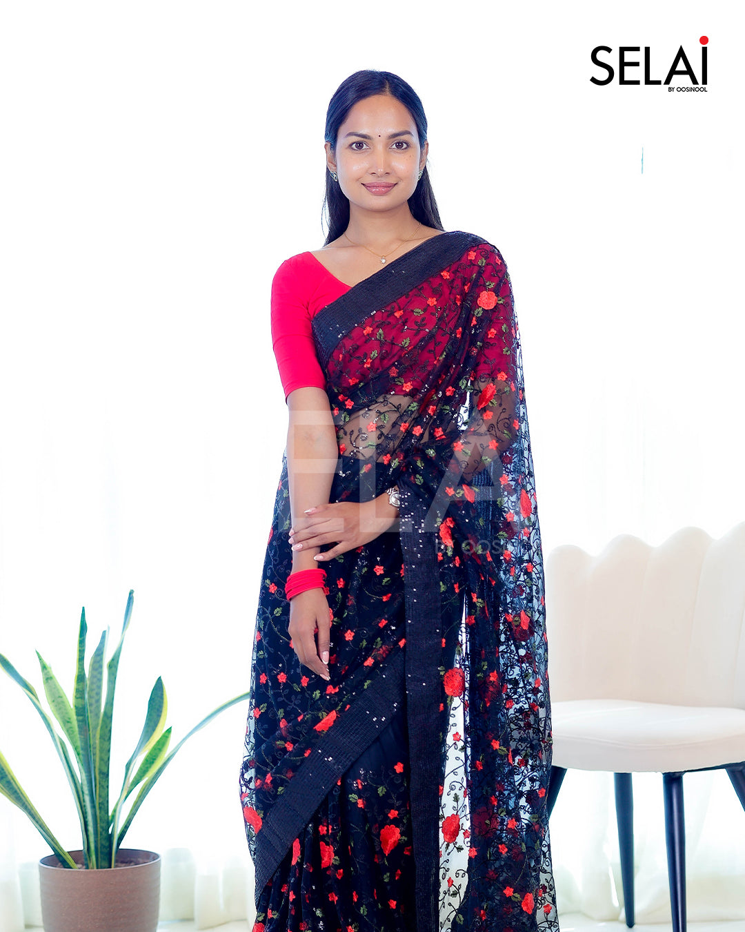 Black sequence and thread embroidered net saree